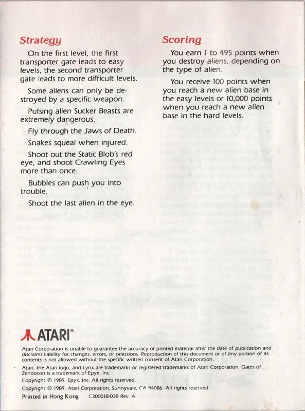 Darrera pàgina del manual anglès amb els apartats Strategy i Scoring, el logotip d’Atari i el peu legal.