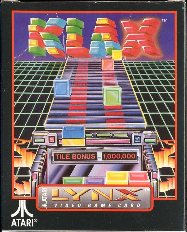 Frontal de la capsa nord-americana de Klax per a Atari Lynx, amb fitxes de colors baixant per una cinta transportadora.
