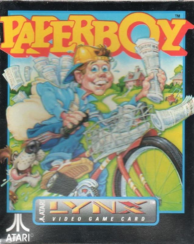 Portada nord-americana de Paperboy per a Atari Lynx, amb un repartidor en bicicleta perseguit per un gos.