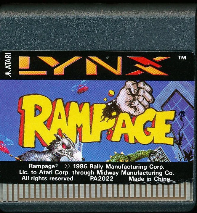 Targeta de Rampage per a Atari Lynx amb etiqueta il·lustrada, referència PA2022 i contactes metàl·lics.