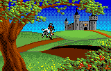 Genet en un camí cap al castell, sota un arbre que ocupa el primer terme.