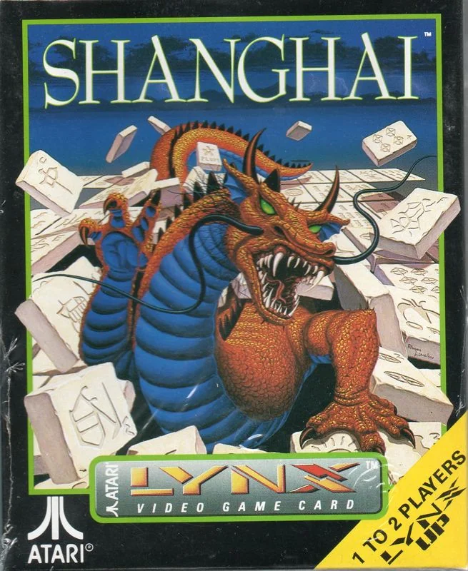 Frontal de la capsa nord-americana de Shanghai per a l’Atari Lynx, amb un drac entre fitxes i una franja que indica que hi poden jugar una o dues persones.