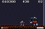 Hiro davant d’un adversari més gran, sobre un terra taronja, durant un combat contra un enemic final.