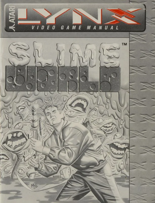 Portada grisa del manual de Todd's Adventures in Slime World, amb el logotip Atari Lynx i l’explorador entre criatures.