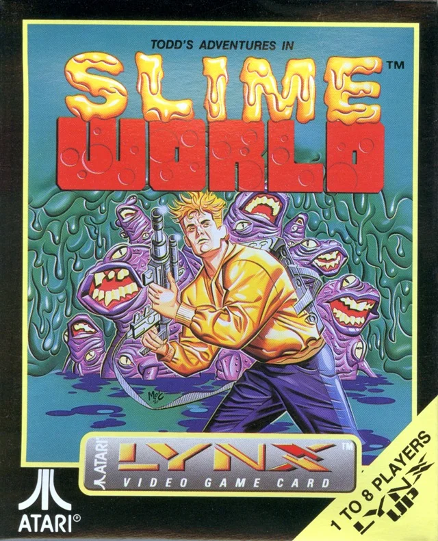 Frontal de la capsa nord-americana de Todd's Adventures in Slime World per a l’Atari Lynx, amb un explorador armat entre criatures morades.
