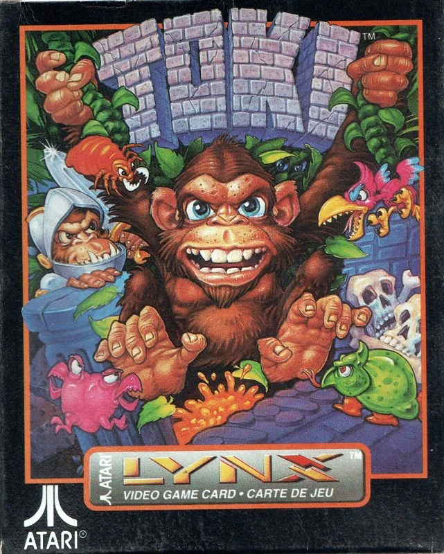 Frontal de la capsa de Toki per a Atari Lynx, amb el protagonista, un simi, envoltat de monstres.