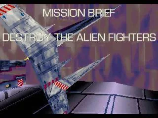 Pantalla d’instruccions de la missió de DarXide amb l’ordre de destruir els caces alienígenes sobre una nau dins d’un conducte.
