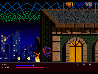 Spider-Man s'arrapa a la paret lateral d'un edifici mentre el terrat inferior crema.
