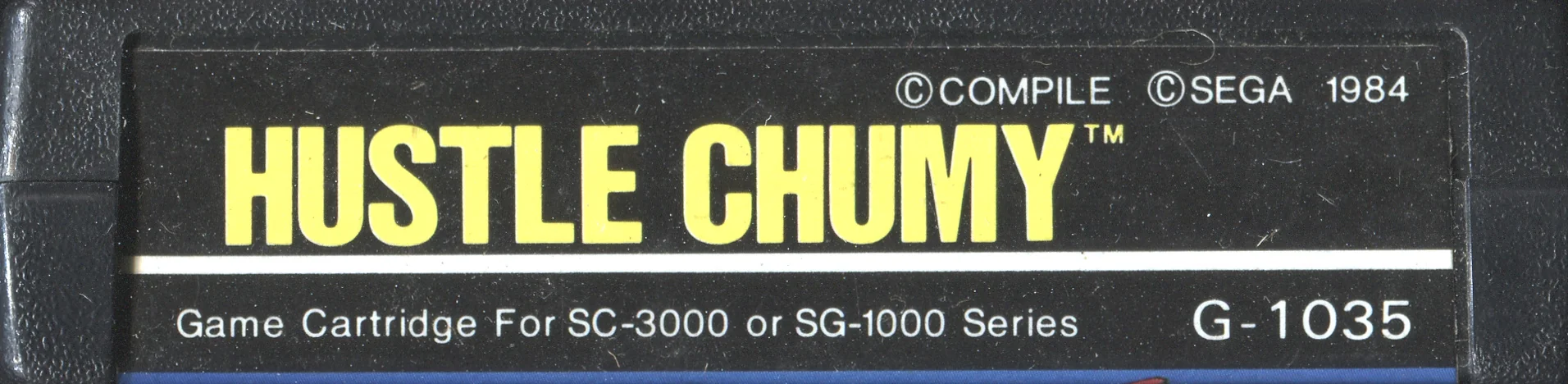 Etiqueta superior del cartutx japonès de Hustle Chumy amb Compile, Sega, 1984 i G-1035.