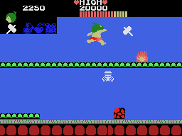 Boy salta en un escenari lateral de Wonder Boy per a SG-1000 mentre s’acosta a enemics i obstacles.