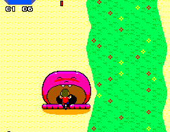 Alex Kidd entra amb la bicicleta a la boca d’una gran criatura rosa que funciona com a sortida.