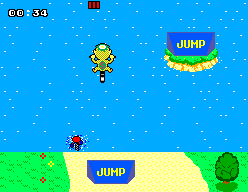 Alex Kidd és dins l’aigua prop de dues rampes JUMP i d’un adversari.