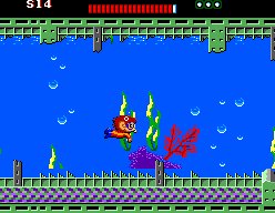 Alex Kidd neda entre plantes i estructures metàl·liques en una ronda submarina.