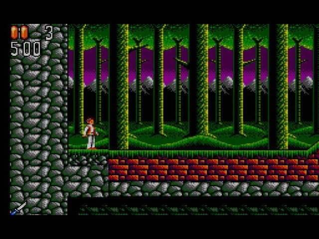 Jonathan Harker inicia un tram de bosc al costat d’un mur de pedra.