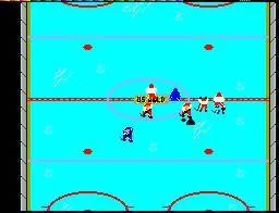 Partit de Championship Hockey vist des de dalt, amb jugadors dels dos equips concentrats al centre de la pista.