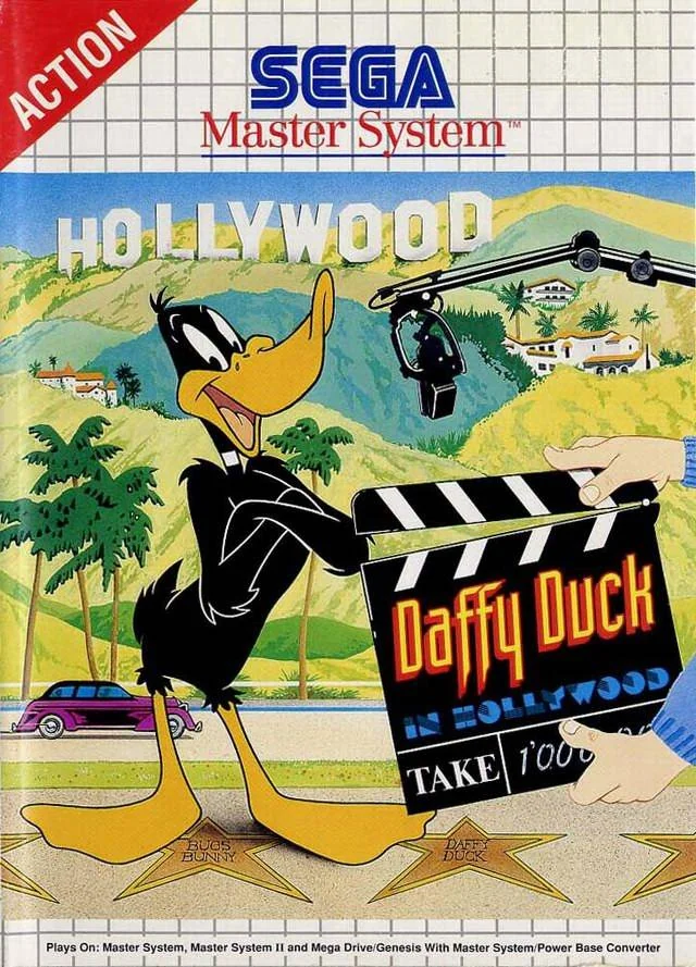 Portada frontal europea de Daffy Duck in Hollywood per a Sega Master System, amb Daffy davant d’una claqueta.