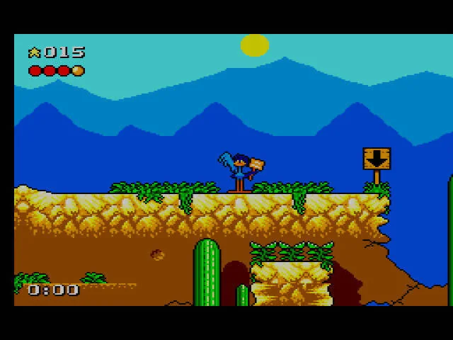 Road Runner aturat davant d’un senyal amb una fletxa descendent en una plataforma del desert.
