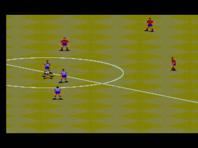 Partit de FIFA International Soccer vist en perspectiva isomètrica, amb futbolistes dels dos equips disputant la pilota al cercle central.