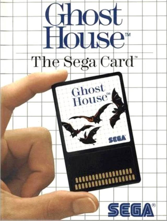 Portada nord-americana de Ghost House amb una mà que sosté la Sega Card decorada amb ratpenats.