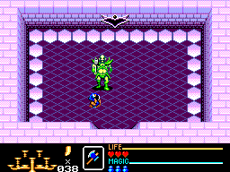 El protagonista de Golden Axe Warrior combat una gran criatura verda dins una cambra de laberint.