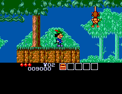Mickey es prepara per travessar una zona forestal amb un mico penjant entre les plataformes.