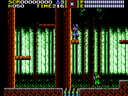 Ryu està aferrat a un tronc mentre dos ninjes verds s’apropen pel bosc.