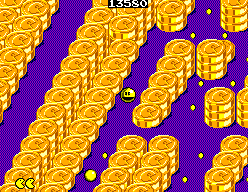 Pac-Man recorre un laberint morat vorejat per piles de monedes daurades a Coin World.
