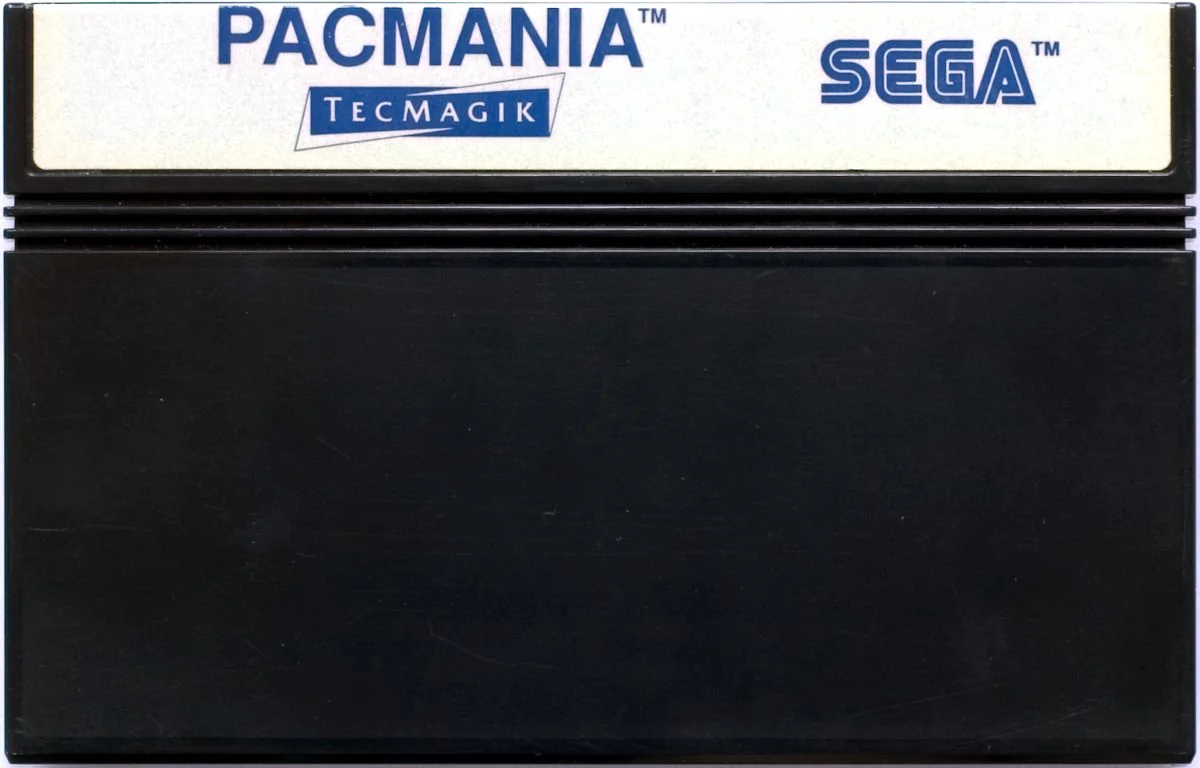 Cartutx europeu de Pac-Mania per a Sega Master System, amb etiqueta blanca i logotips de Pac-Mania, Tecmagik i Sega.