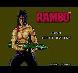 Pantalla de títol nord-americana amb el logotip Rambo, el protagonista armat i el missatge PUSH START BUTTON.