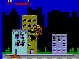 George enfilat a una façana mentre Lizzie camina pel carrer en la versió de Master System.