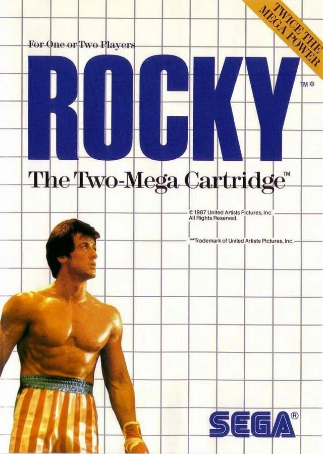 Portada europea de Rocky per a Sega Master System, amb el títol blau sobre una quadrícula blanca i Rocky a la part inferior.