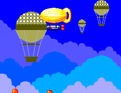 Un dirigible groc i blancs vermells es mouen entre globus aerostàtics i núvols.