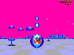 Space Harrier volant cap a diverses naus enemigues sobre un terreny quadriculat.
