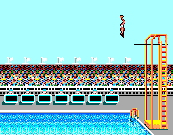 Saltador suspès sobre la piscina durant el salt de plataforma.
