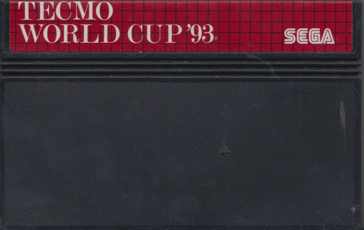 Cartutx europeu de Tecmo World Cup '93 per a Sega Master System amb etiqueta vermella.