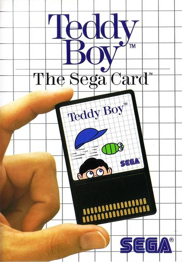 Portada nord-americana de Teddy Boy amb una mà sostenint la Sega Card davant d’una quadrícula blanca.