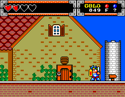 Shion recorre un carrer de Purapril davant d’una casa taronja i una torre blanca.
