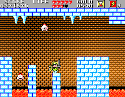 Wonder Boy recorre el castell de gel entre blocs glaçats, estalactites i petites criatures.