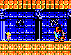 Tom-Tom combat un King armat dins una sala de maons blaus.